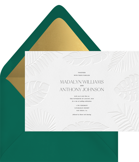 Subtle tropical wedding invitation examples with white letterpress palm fronts on white invitations